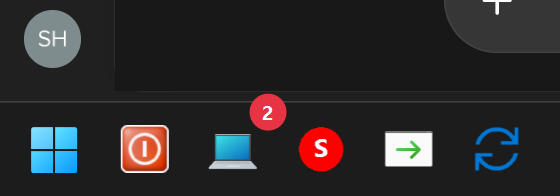 WindowsタスクバーのノートPC形ランチャーアイコン右上に赤い2のバッジ。周囲のアイコンと上のウィンドウの一部も写っている